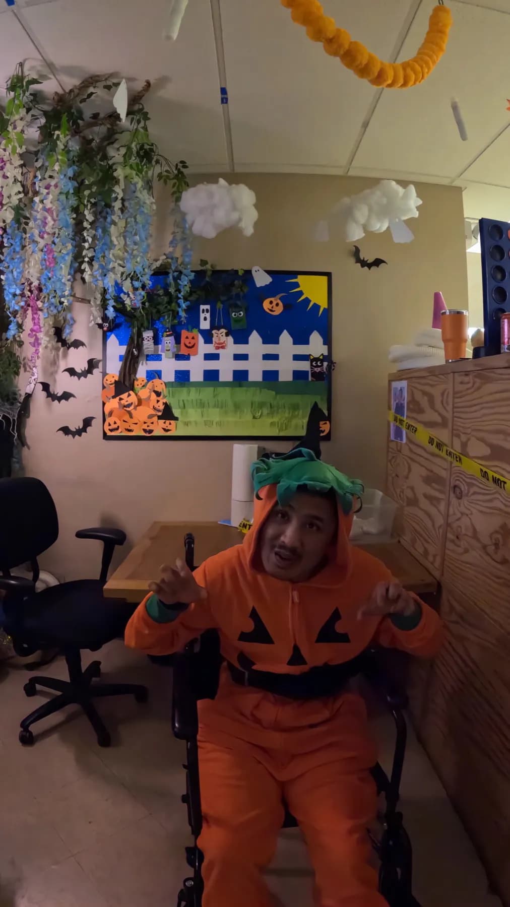 Seasonal costume moment in a decorated community room